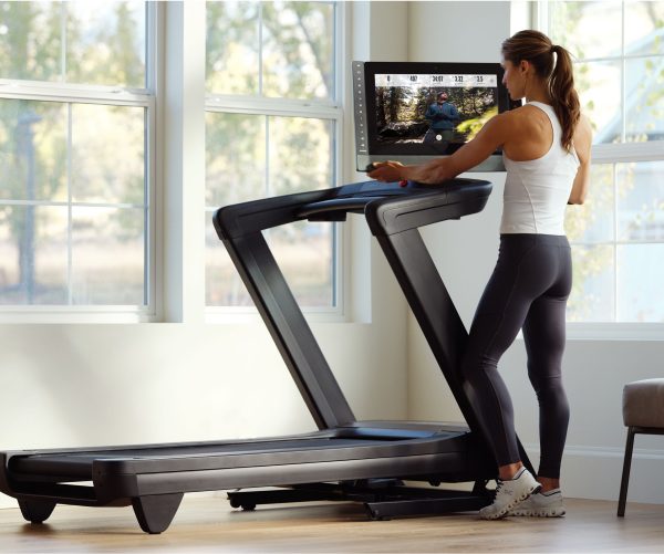 Woman Using an iFIT Workout at Home on Her NordicTrack Treadmill