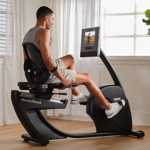 Person using a NordicTrack 10 Recumbent Bike at home, showing low-impact cardio exercise for bad knees