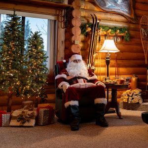 Santa Claus sitting next to the best Black Friday treadmill deal for a NordicTrack Commercial 2450.