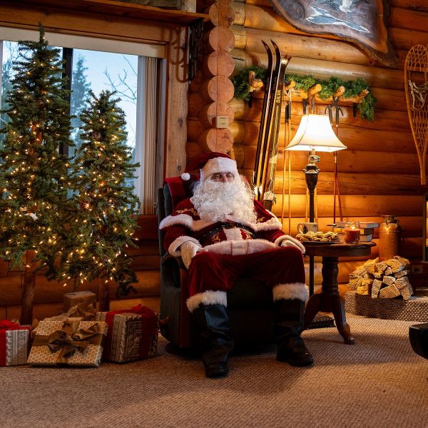 Santa Claus sitting next to the best Black Friday treadmill deal for a NordicTrack Commercial 2450.