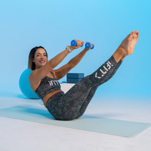 iFIT Trainer Jeni DelPozo performing mat pilates.