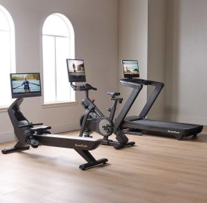 NordicTrack home gym featuring a treadmill, bike, and rower with iFIT workouts in a modern living space